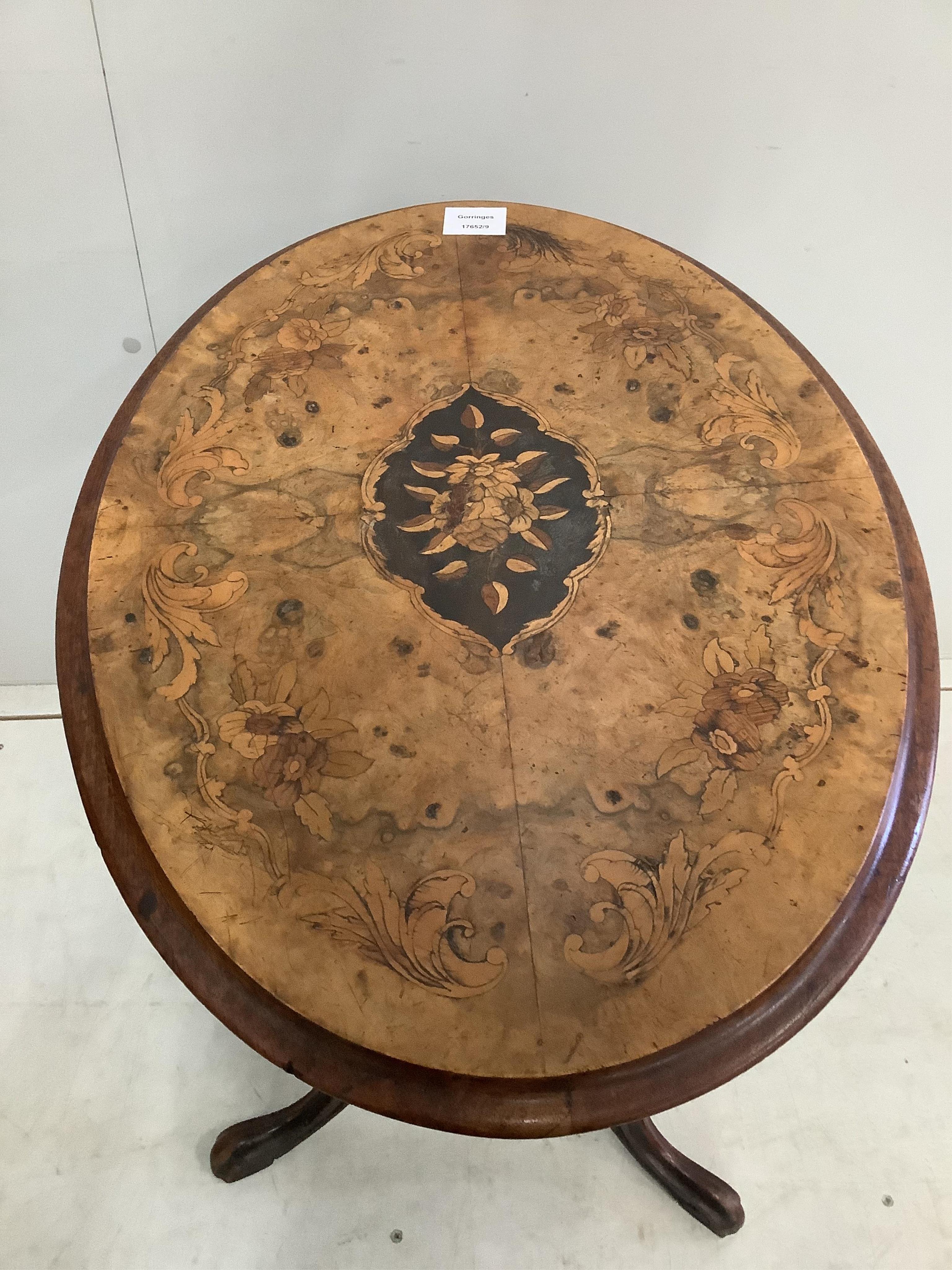 A Victorian marquetry inlaid oval walnut tripod wine table, width 60cm, depth 40cm, height 69cm